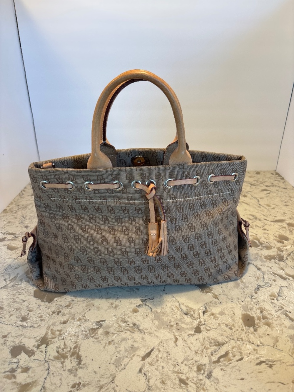 Dooney & Bourke Monogram Canvas Small Tulip Tassel Tote Handbag